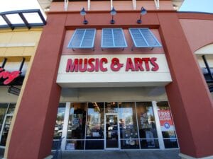 A store front of a music and arts shop.