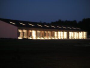 A blurry picture of a warehouse during the night